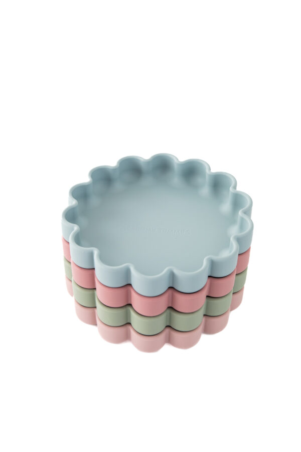 Baby weaning flower plates stacked on top of each other